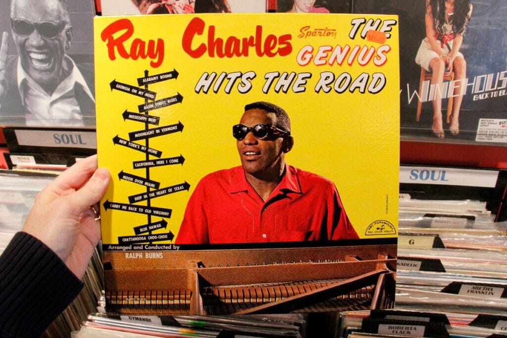 Image of someone holding up a Ray Charles record