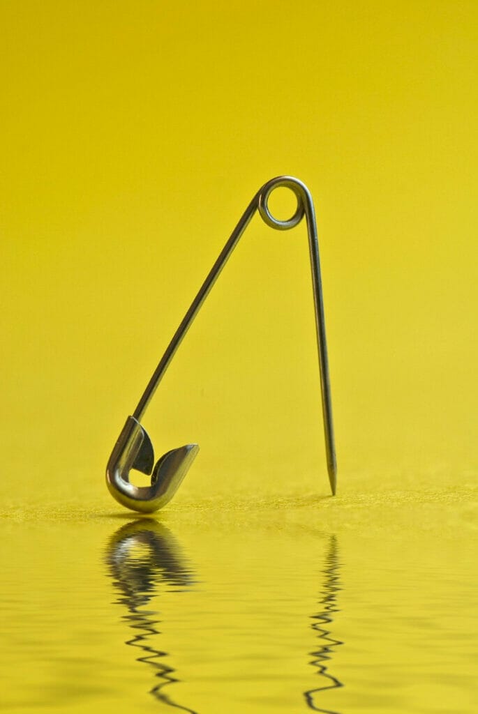Safety pin with a yellow backdrop