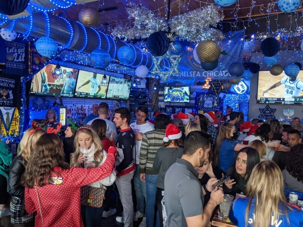 People drinking at the 8 Crazy Nights bar in Chicago 