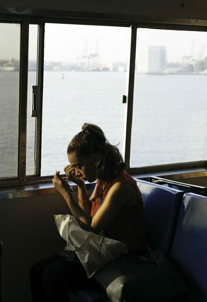 Girl sitting on the Staten Island Ferry 