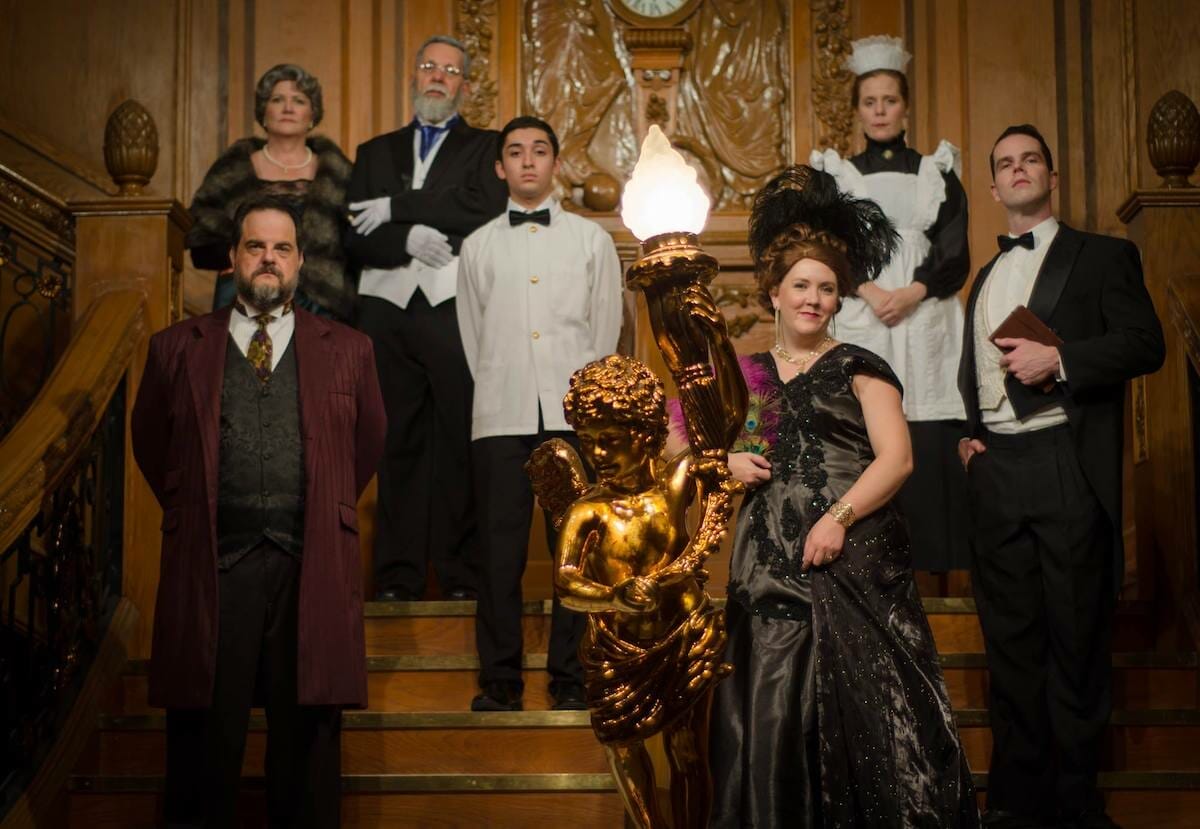 Promotional photo of Titanic: The Artifact Exhibition Orlando, featuring dressed up employees to fit the time period