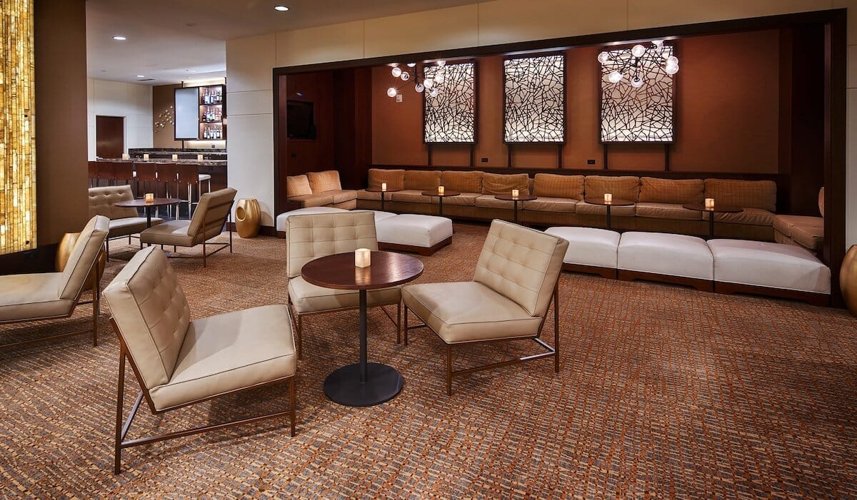 Interior of The Lincoln Marriott Cornhusker Hotel in Lincoln Nebraska, featuring a cozy and warmly decorated seating area in the lobby.