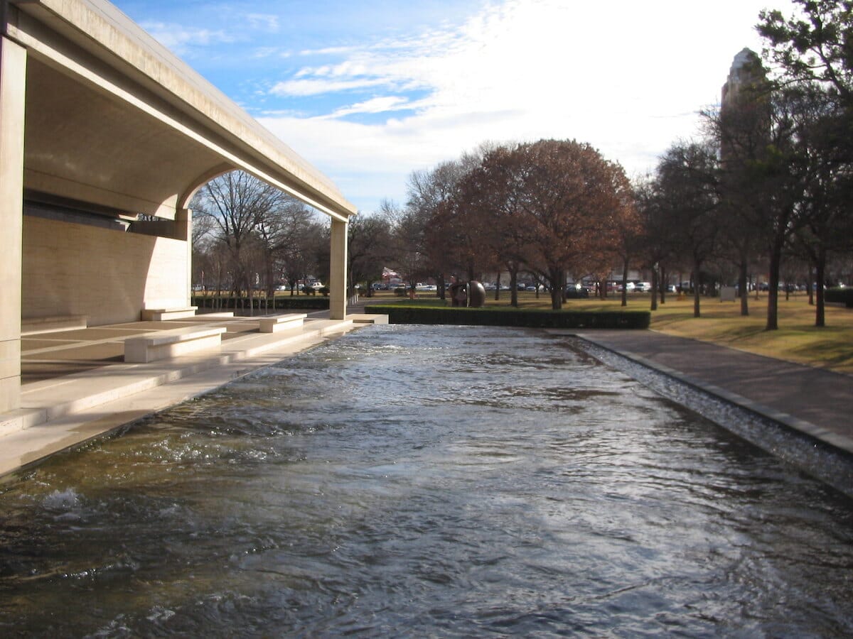 Exterior of the Kimbell Art Museum in Fort Worth, featuring a walkway and decorative pool