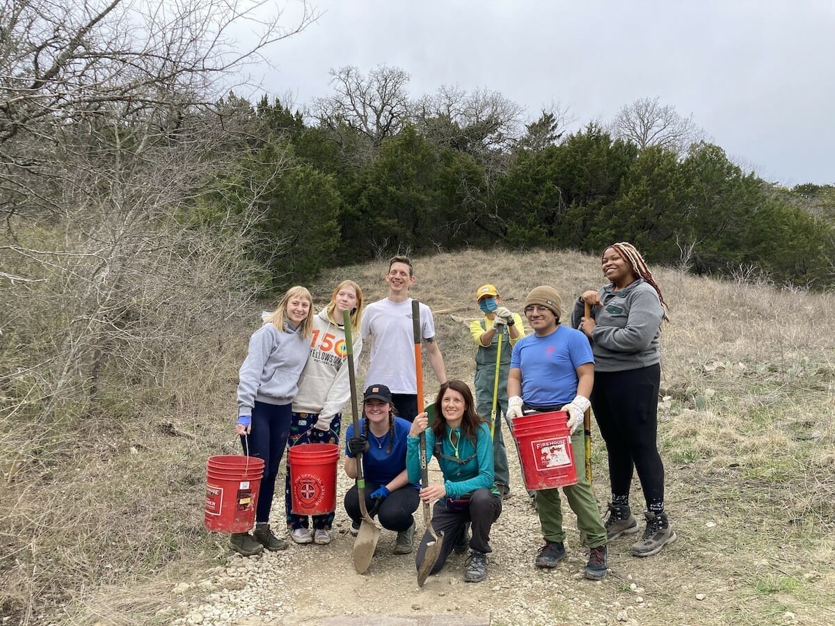 A smiling group of volunteers at Cedar Ridge Preserve in Dallas