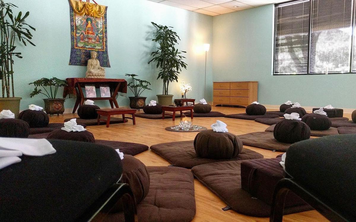 Interior of the Dallas Meditation Center, with meditation pillows and mats arranged in a circle on the floor