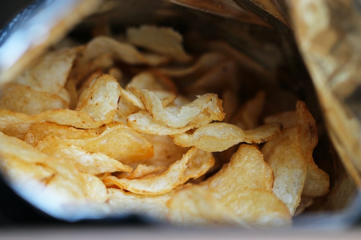 An open bag of potato chips