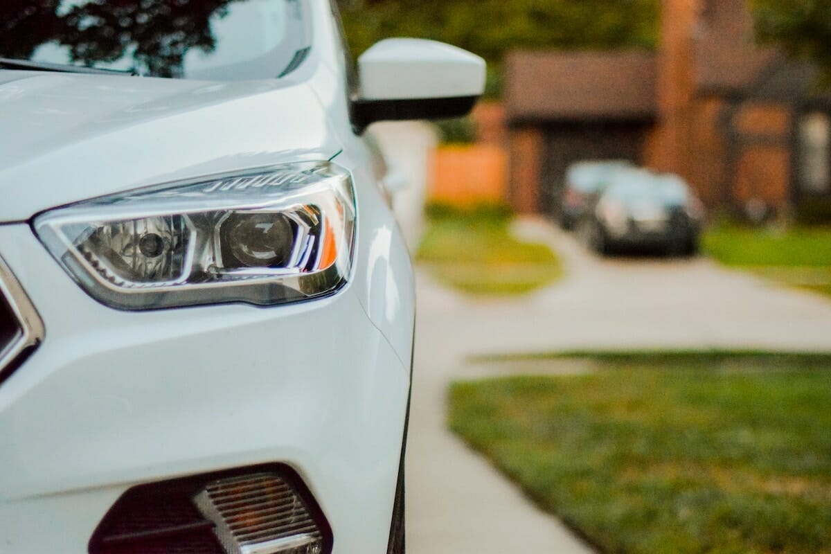 Partial view of the front of a white car