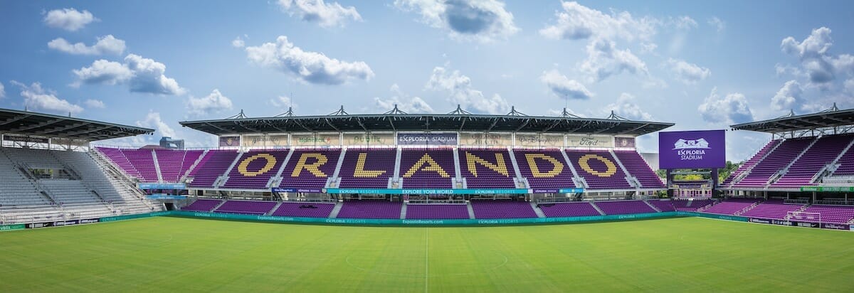 Exploria Stadium in Orlando, showing the purple seats above the green soccer field
