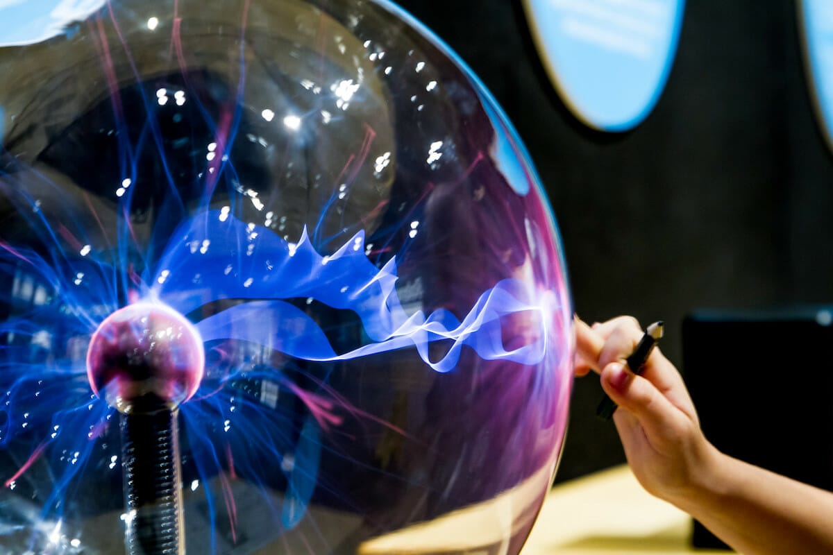 A child's hand on a plasma ball at the Orlando Science Center