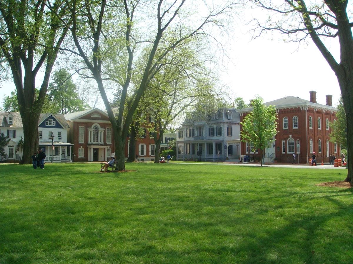 green grass bordered by historic homes in Dover, Delaware's First State Heritage Park