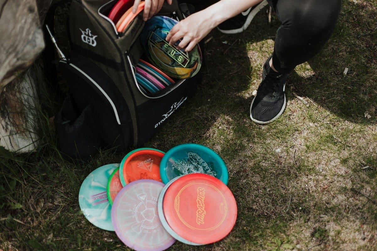 a backpack full of colorful frisbees
