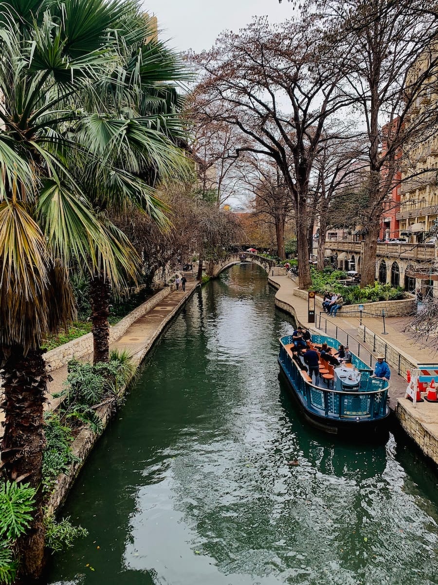 a tour boat in the canal along the San Antonio River Walk, one of the most beautiful places in America